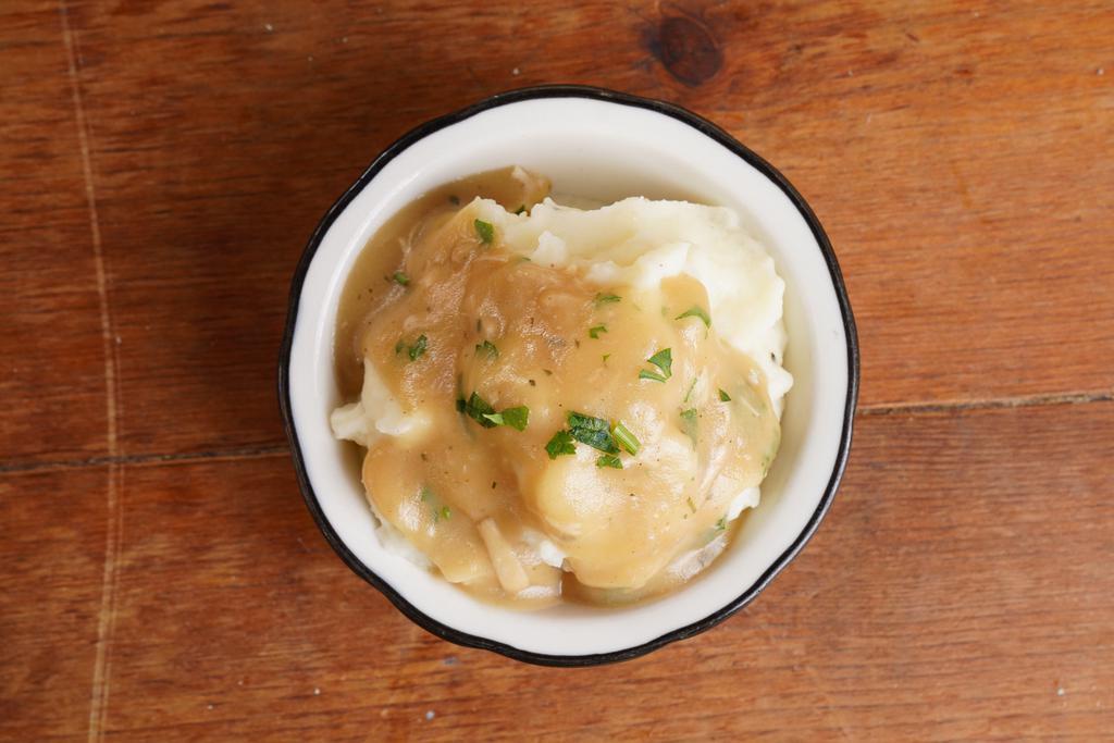 Mashed Potatoes and Gravy · Kind of lumpy, really buttery mashed potatoes with chicken gravy