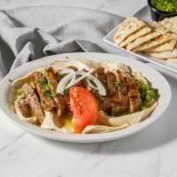 Gyro Hummus · Our delicious gyro meat served over a bed of hummus, served with pita. A neighborhood favori...