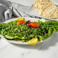Tabouli Salad · Finely chopped parsley and tomatoes mixed with cracked wheat, olive oil, lemon juice, and he...