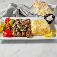 Kifta Kabob · Ground lamb mixed with onion, parsley, and Mediterranean spices, grilled and served with tah...