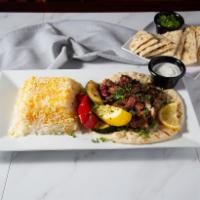 Sumac Chicken · Tangy, marinated chicken with olive oil and onions, served with warm pita.
