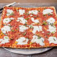 Brooklyn Pizza · An extra thin crust Sicilian with plum tomatoes, very light fresh mozzarella, basil, oregano...
