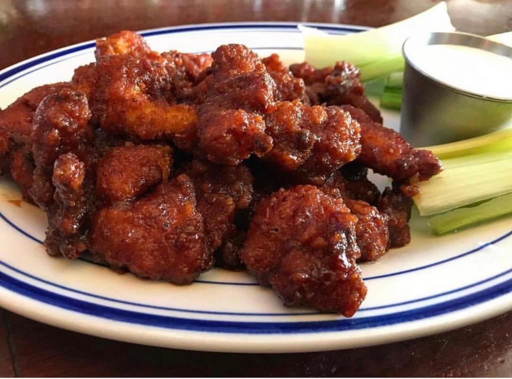 Buffalo Bites · Breaded boneless chicken bites tossed in 1 of our signature sauces with blue cheese or ranch.
