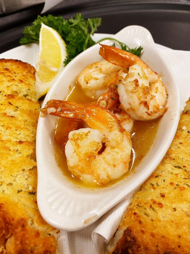 Shrimp Scampi App · Jumbo white shrimp sauteed with garlic, white wine, butter and olive oil. Served with garlic bread.