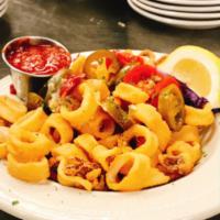 Fried Calamari · Our domestic calamari is tender and lightly breaded, sprinkled with sea salt and cracked pep...