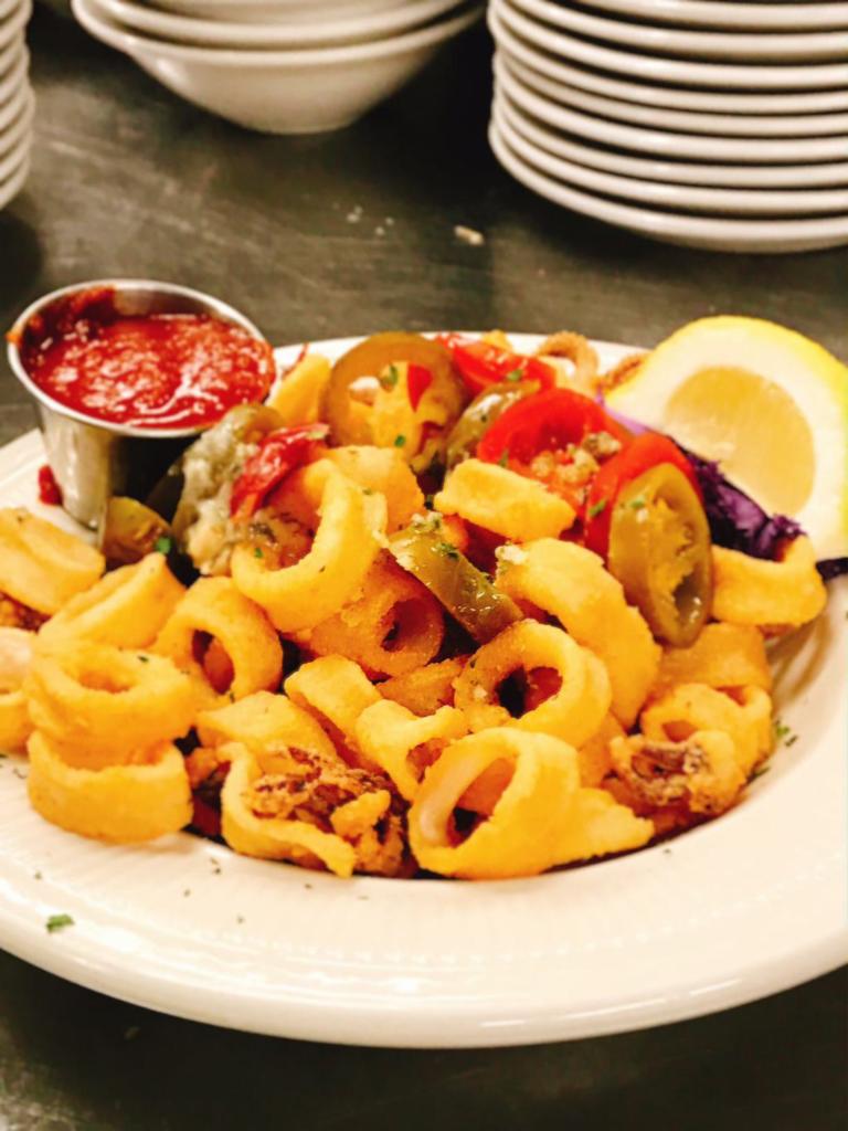 Fried Calamari · Our domestic calamari is tender and lightly breaded, sprinkled with sea salt and cracked pepper, served with a side of marinara sauce.