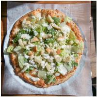 The Grilled Chicken Caesar Pizza Salad · Romaine lettuce, grilled chicken, parmesan cheese, with caesar dressing and croutons on top ...