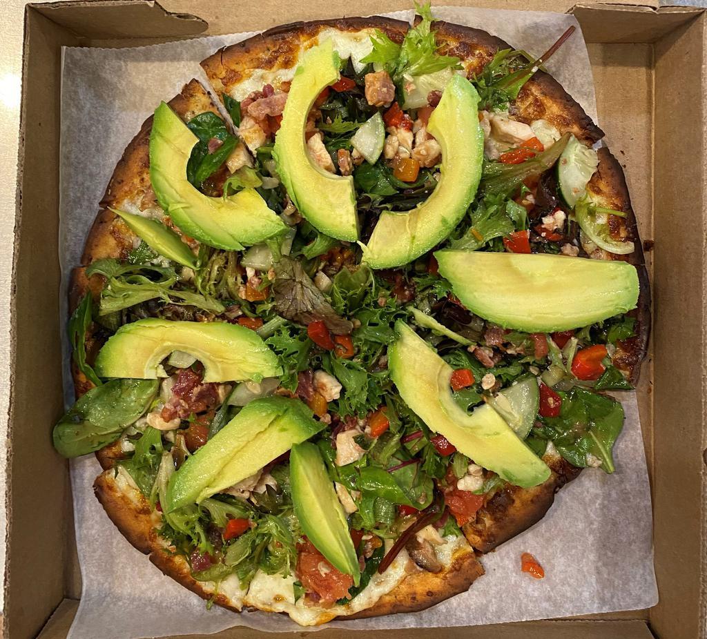 The California Pizza Salad · Mixed greens, cucumber, tomato, grilled chicken, bacon, roasted red pepper, with balsamic or ranch dressing, and avocado on top of a cheese pizza with red onions and a gluten free crust.