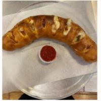 Build Your Own Stromboli · Build your ouwn Stomboli.  Pizza crust topped,  rolled, slit and baked to a golden brown.  C...