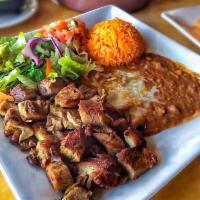 Carnitas Michoacan · Tender chunks of seasoned pork marinated in spices. Served with rice, beans, pico de gallo, ...