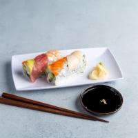Rainbow Roll · Crab meat, avocado and cucumber topped with salmon, tuna, white tuna and shrimp.