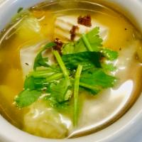 Soft Tofu Soup · Vegetable broth, garlic oil and baby bok choi.  Vegan.