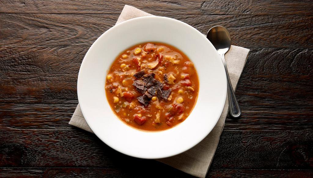 Fire Roasted Tortilla Soup · Soup made with fried corn tortilla and seasoned tomato broth. Gluten-sensitive. 
