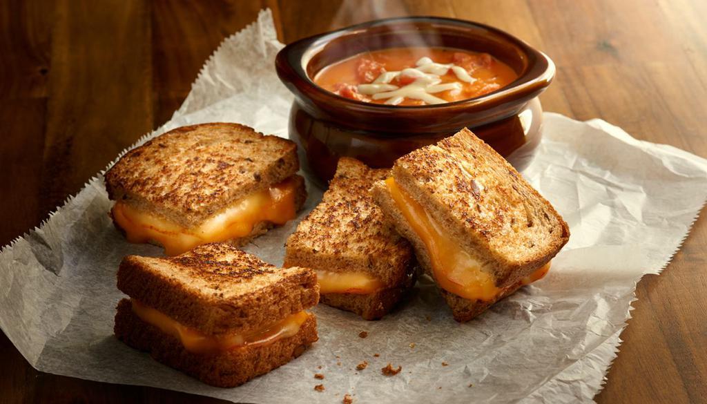Grilled Cheese and Tomato Soup Combo · It's back! Grilled Muenster and cheddar cheese sandwich on multigrain wheat, bowl of tomato basil soup. Vegetarian.