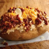 Texas Style Spud Potato · Chopped pit-smoked beef brisket, barbecue sauce, cheddar, butter on a baked potato. Gluten-s...