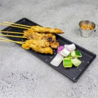 Panang Satay Chicken · Marinated chicken on skewers, charcoal grilled to perfection. Served with Malaysian specialt...