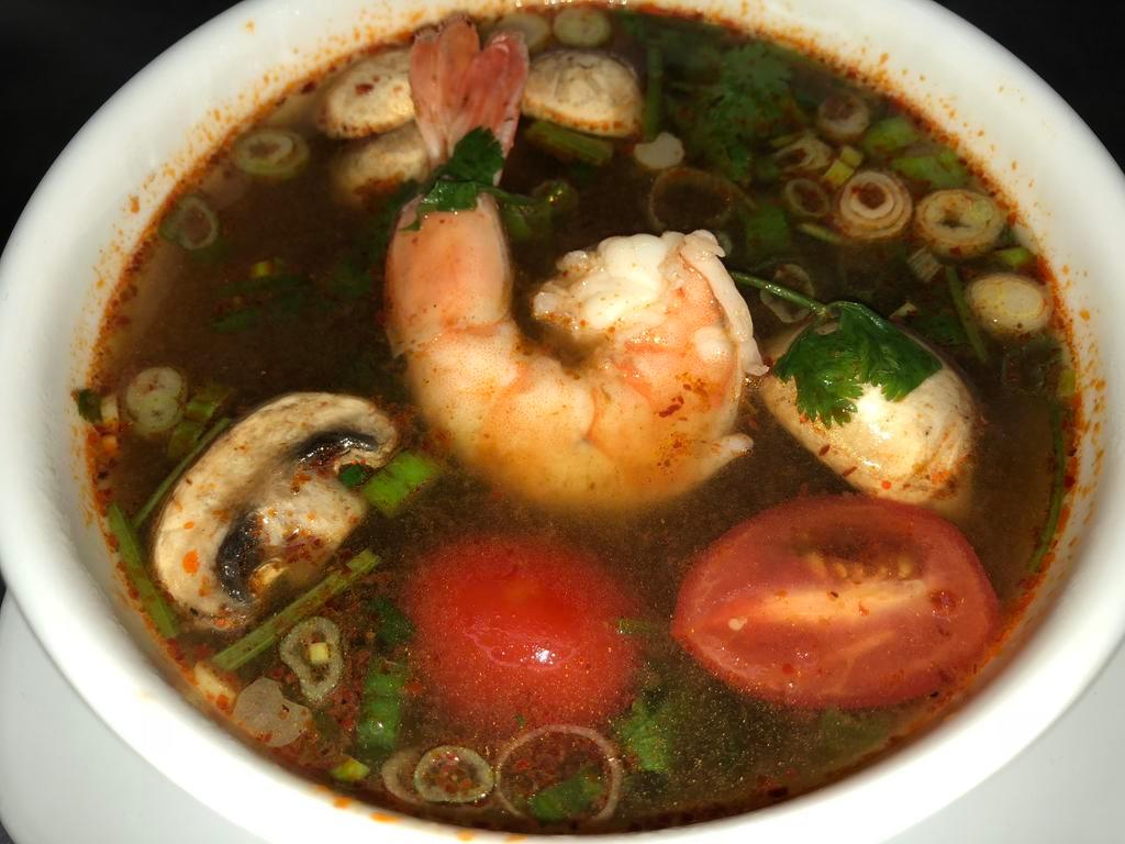 Tom Yum Soup · Choice of shrimp, chicken or veggie. Savory sour soup, mushrooms, lemongrass, lime leaves, tomatoes and chilies. Spicy.
