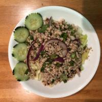 Larb Salad · Spiced minced chicken, beef or tofu, rice powder, mint and red chilies and side of lettuce. ...