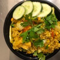 Pineapple Fried Rice · Fried rice, pineapple, onions, carrots, eggs, cashew nuts and yellow curry flavor.