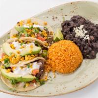 Carne Asada Tacos · Corn tortillas with grilled skirt steak, avocado, charred corn, pico de gallo, cilantro, sou...