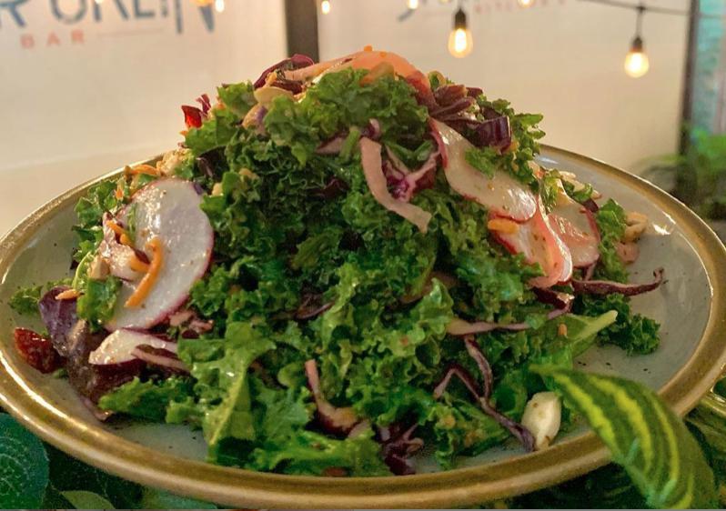 Kale Salad · Red cabbage, carrots, pickled red onions,  red radishes, roasted cashews, dried cranberries & Dijon vinaigrette