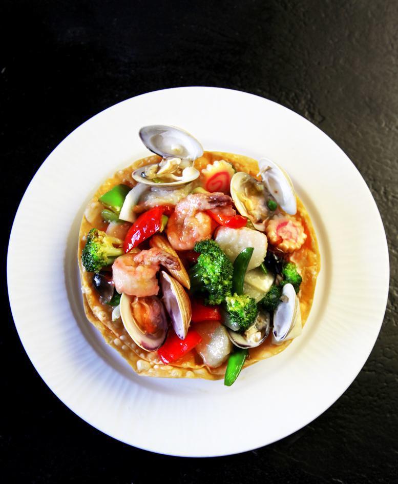 Treasure Nest · Sea scallops, little neck clams, mussels and jumbo shrimp with fresh vegetables.  Choice of sauce.