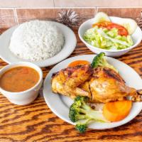 Baked Chicken Lunch Special /Pollo al horno · A quarter baked chicken with white rice and beans 
