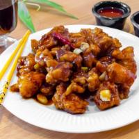 8. General Chicken · Large chunks of chicken deep fried until crispy and served with general sauce hot. Hot and s...