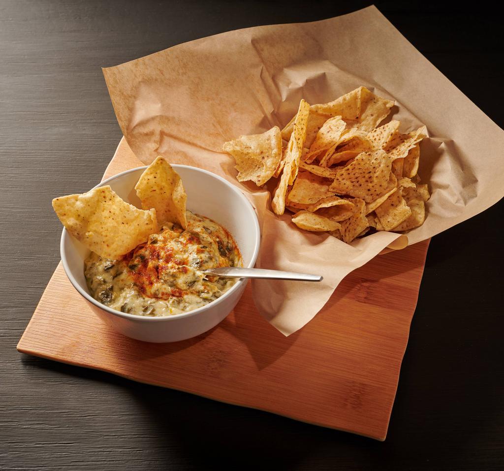 Spinach Artichoke Dip · Served with tortilla chips.