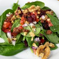 Spinach Salad Large · Fresh Spinach greens, dried cranberries, walnuts, red onions, bacon, tomatoes and homemade b...