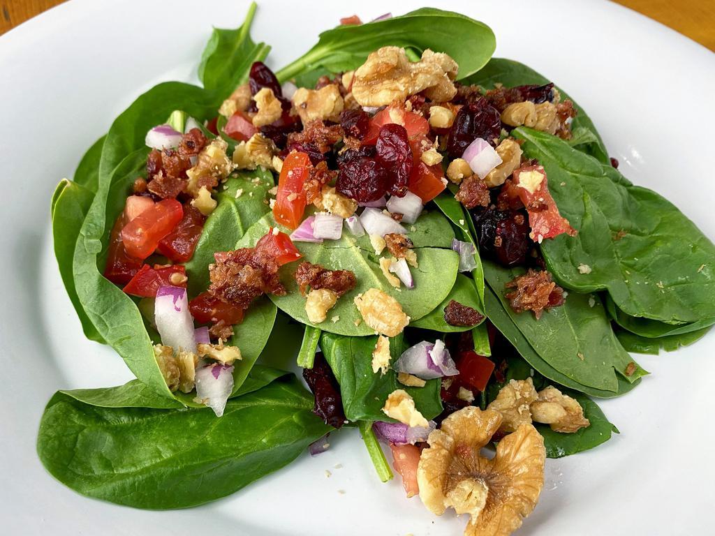 Spinach Salad Large · Fresh Spinach greens, dried cranberries, walnuts, red onions, bacon, tomatoes and homemade balsamic vinaigrette. 