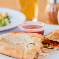 Meat Lovers Calzone · Pepperoni, spicy sausage, Canadian bacon and mozzarella.