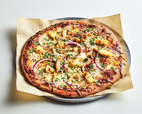 BBQ Chicken Pizza · Zesty house-made BBQ sauce, melted mozzarella cheese, with red onions, cilantro, topped with grilled chicken.