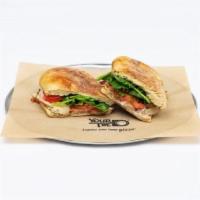 Chicken Bacon Club Panini · House-made ranch with spinach, Roma tomatoes, grilled chicken and bacon, topped with sliced ...
