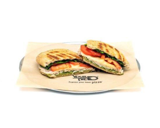 Pesto Turkey Panini · Fresh basil pesto with spinach, Roma tomatoes, and hand-carved turkey breast, topped with sliced provolone.