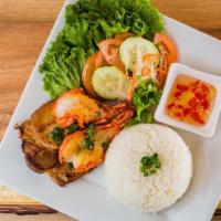 42. Com Tom Suong Nuong · Grilled pork chops and prawns, served with vegetables and steamed rice.