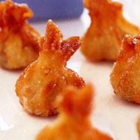 Crispy Wonton · Chicken stuffing in a wonton skin, fried and served with sweet chili sauce.