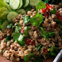 Larb Gai Salad · Ground chicken in chili lime juice with red onion, mint, roasted rice, scallion and cilantro...
