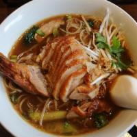 Duck Noodle Soup · Thai style noodle soup with sliced duck, watercress, scallions, and cilantro.