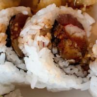 48. Wolverine Roll · Eel, avocado, tuna, shrimp tempura, eel sauce and crab.