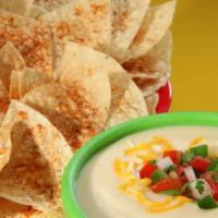 Chips and Queso · Basket of fresh tortilla chips seasoned with Fuzzy Dust and served with queso.