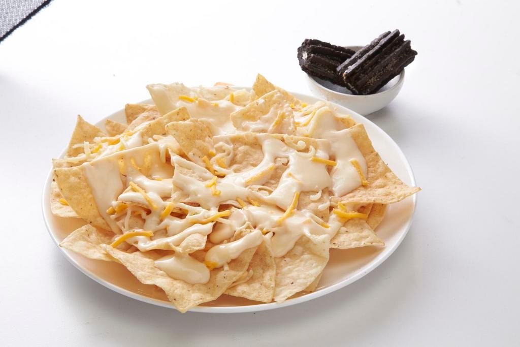Kids Cheese Nachos · Fresh tortilla chips topped with shredded cheese and queso.

