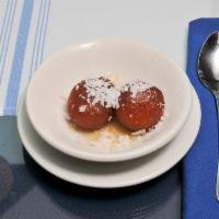 Gulab Jamun · Made with milk powder fried as berry sized balls and dunked in a sugar syrup.
