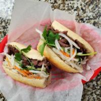 13. Banh Mi Bo Nuong · Grilled beef sandwich.