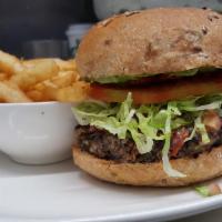 BLACK BEAN POblANO BURGER  · HOME BAKED grains and BEANS BURGER, Grilled pepper, onion,portobello mushroom topped with pi...