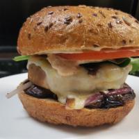 Portobello Eggplant Melt Burger · Pile high grilled mushroom, eggplant, onion, bast of balsamic glaze and melted Muenster chee...