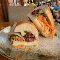Impossible Bánh  Mi VG  · A charboiled vegan impossible burger and vegan ham with pickled daikon and carrot cucumber c...