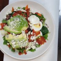 Cobb Salad · Grilled soy chicken, crispy soy bacon, hard boiled eggs, avocado and crumbled Blue cheese ov...