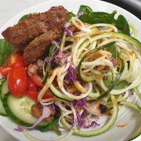 Spiralized Zucchini noodles with beyond meat Salad · Tossed with toasted walnuts, cranberry cucumber cherry tomato and citrus vinaigrette.
