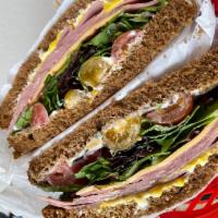 American sandwiches  · Ham and American cheese, mayonnaise, mustard, spring mix salad, slicked cherry tomatoes betw...
